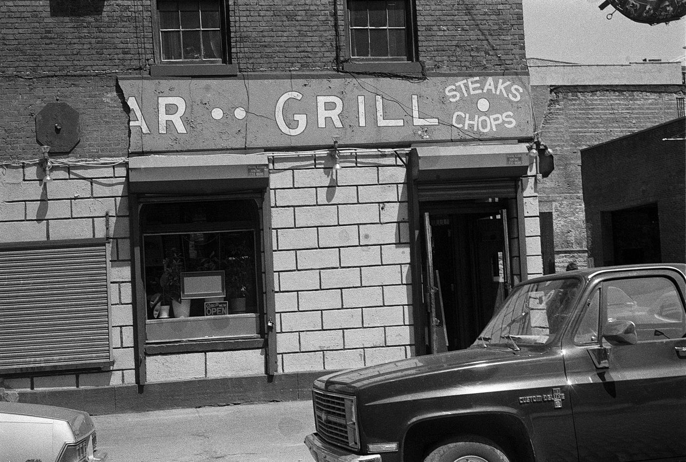 Sign For Old Bar And Grill Offering Steaks And Chops At 2 South Street, Manhattan, 1990