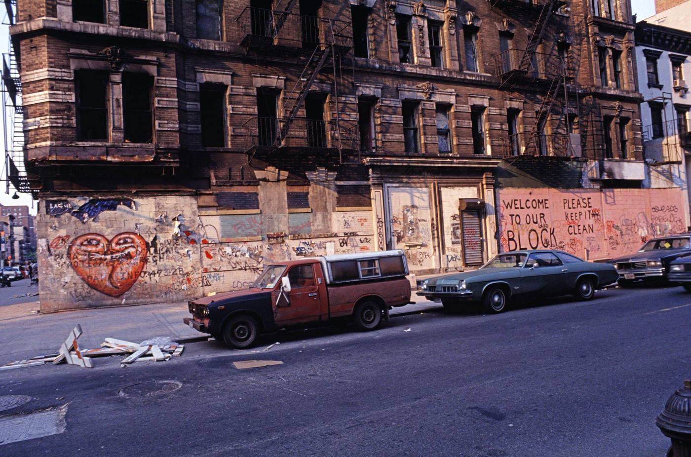 Graffiti-Covered Facade Of An Empty Building In The Lower East Side With Text 'Welcome To Our Block, Please Keep It Clean', Manhattan, 1990