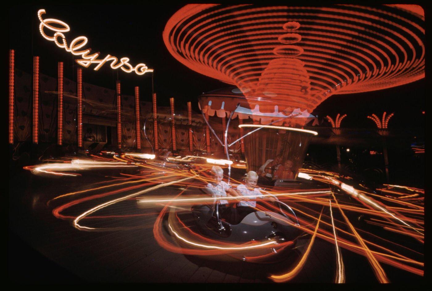 Boy Riding On Neon &Amp;Quot;Calypso&Amp;Quot; Amusement Ride, Manhattan.