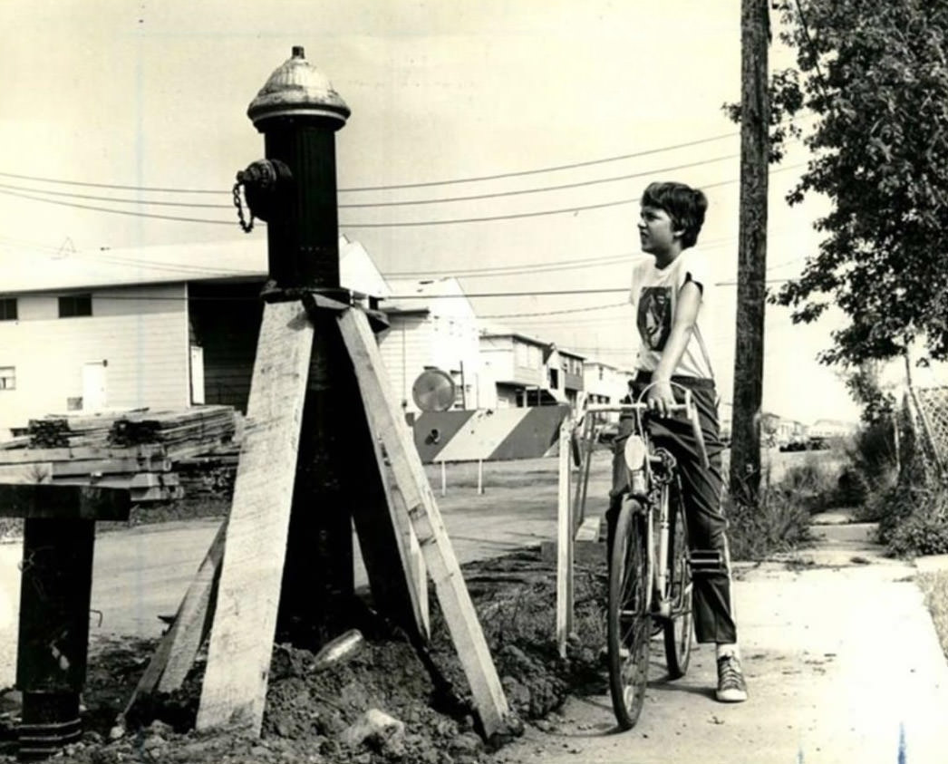 Ricky Seesman Looking At The Hydrant On Naughton Avenue, Staten Island, 1979.