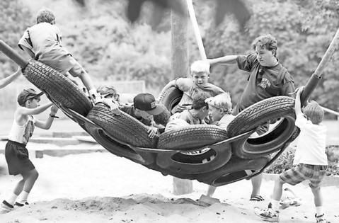 Counselor Kerry Glasgold Gives Campers A Ride On A Tire Swing At The Jcc Camp, Circa 1995.