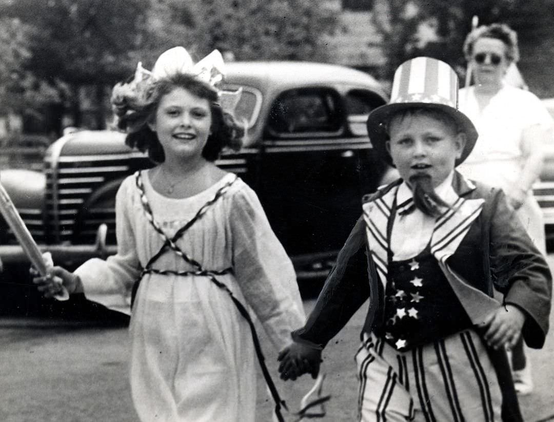 Roberta Pecherski O'Sullivan And Stuart Dalrymple Walk In The 4Th Of July Travis Day Parade, 1950.
