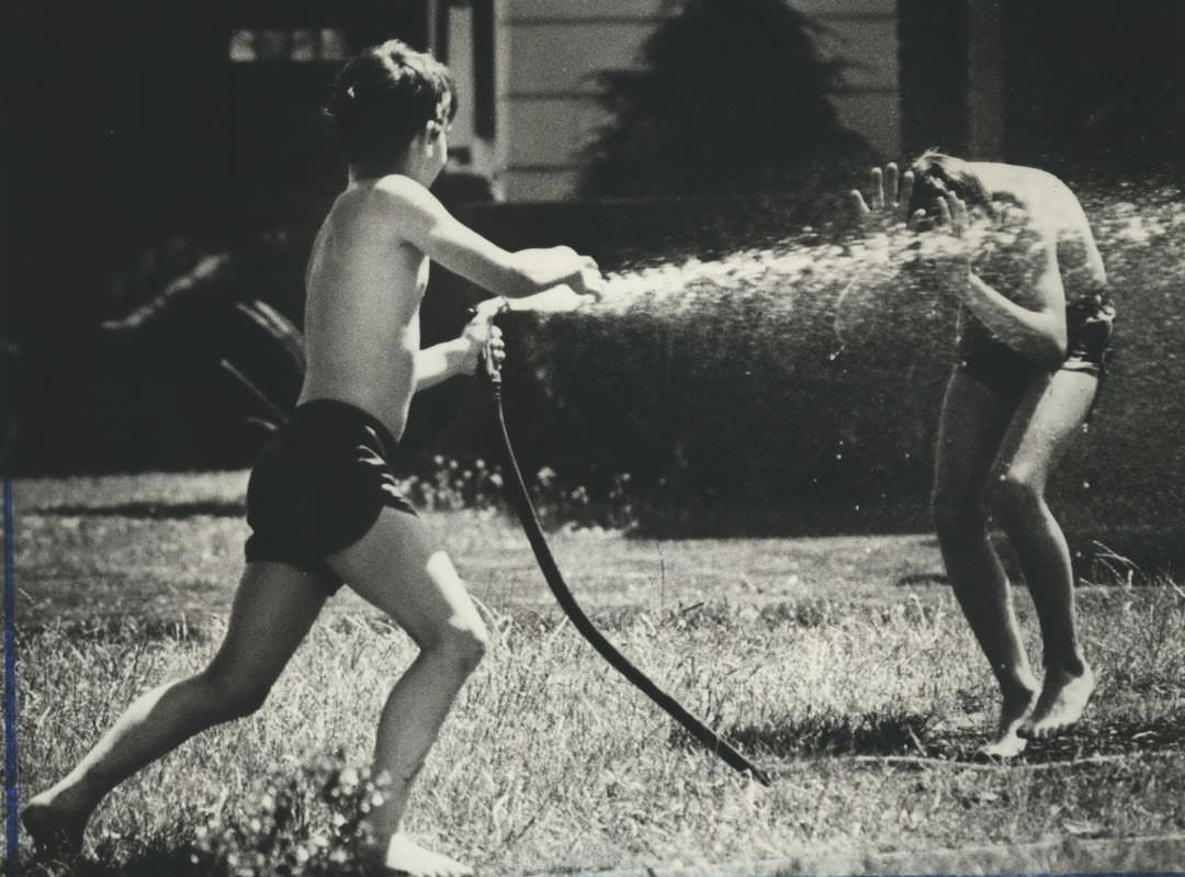 Glenn Christensen Gets The Drop On His Brother Douglas During A Romp On Their Lawn, 1983.
