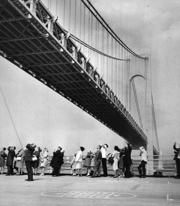 People Aboard The Queen Mary Look Up At The Verrazzano-Narrows Bridge, 1966.