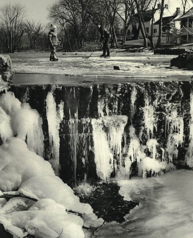 Skaters On Mill Pond In Richmond, Waterfall At Pond Is Frozen, 1985.