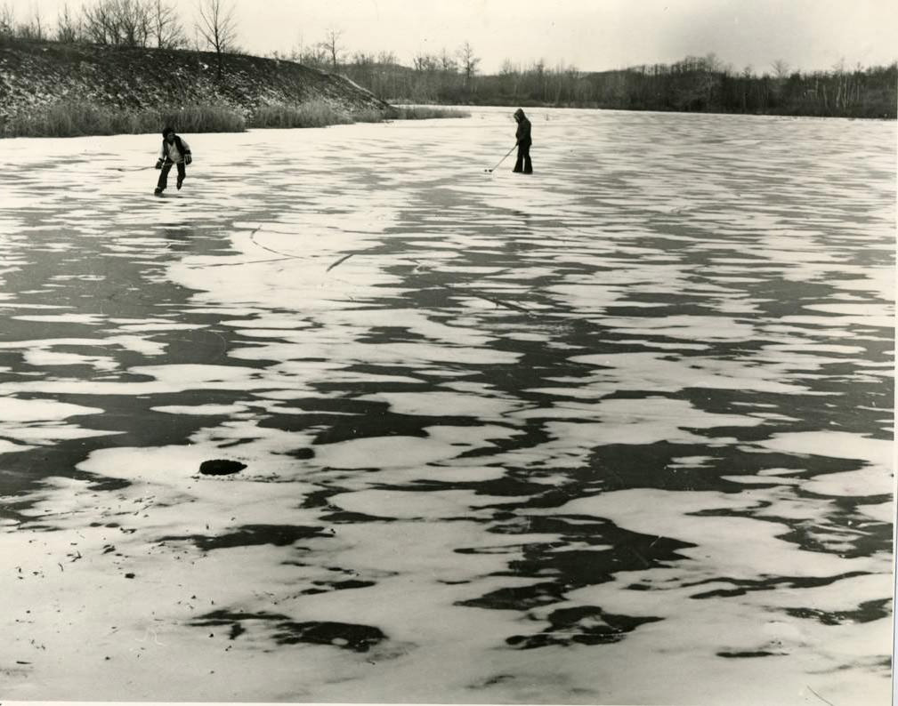 Two Hockey Players On A Frozen Pond Near The West Shore Expressway In Charleston, 1980.