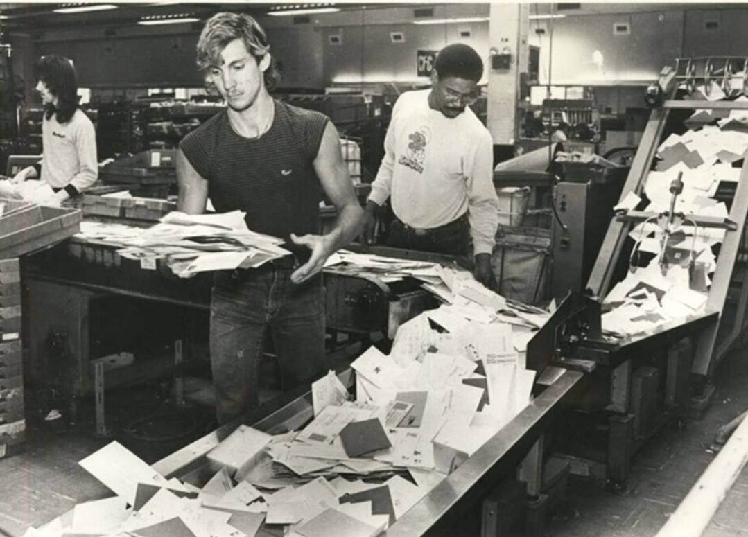 Postal Workers Sort Christmas Mail At Main Post Office On Manor Road In Castleton Corners, 1984.