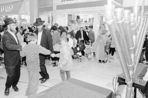 Dancing Near The Menorah At Staten Island Mall, 1997.