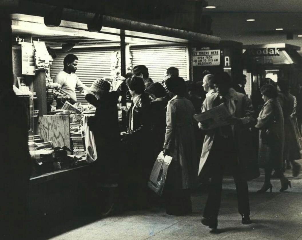 Commuters Grab A Paper At The Staten Island Ferry Terminal, April 1979.