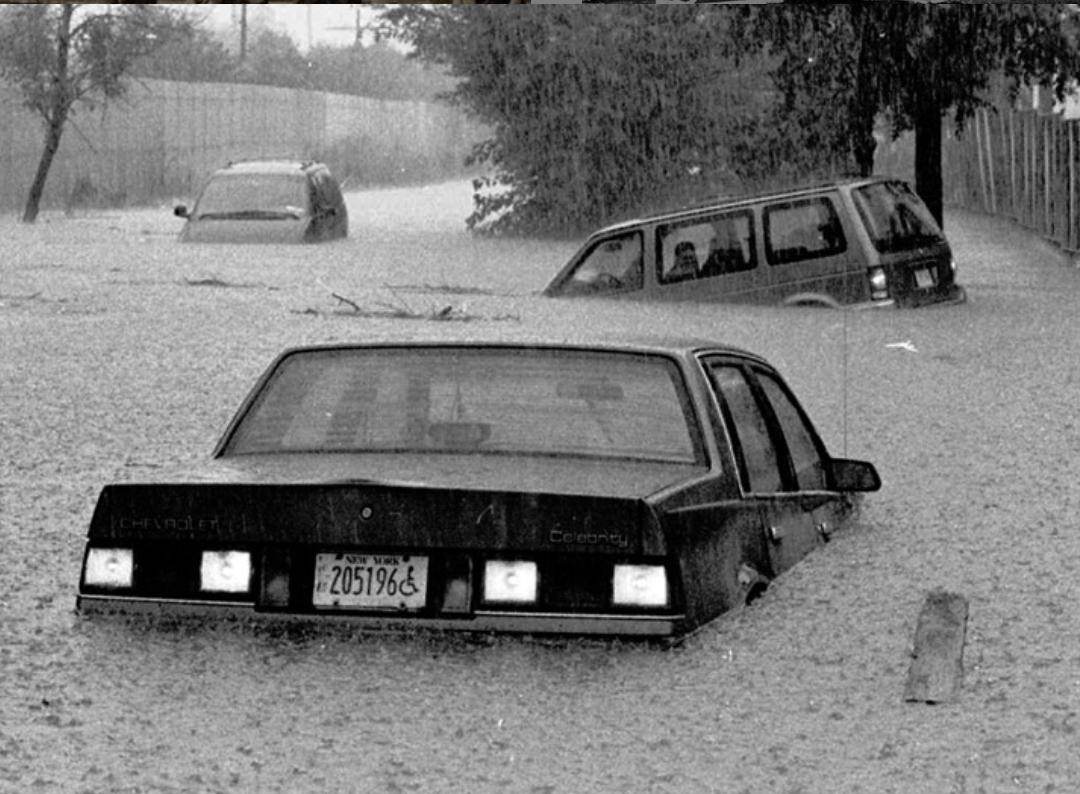 Two Mini-Vans And A Car Stuck In The Water At The Intersection Of North Railroad Avenue And Spratt Avenue In Bay Terrace, 1996.