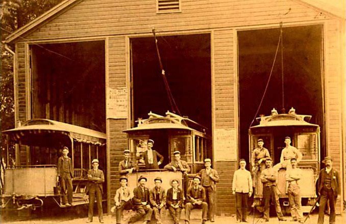 Three Trolleys And A Group Of Workers At A Trolley Barn, Identified As Jewett Ave. In Westerleigh; Trolleys Are Marked Prohibition Park, 1893.