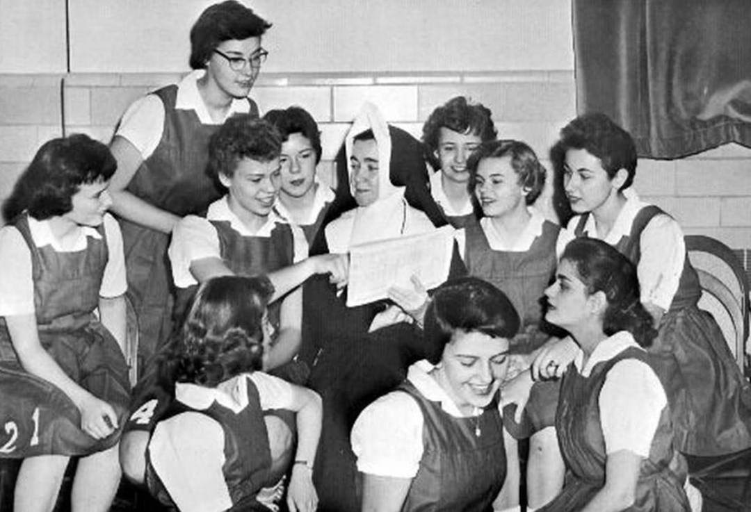 Modest Basketball Uniforms At Notre Dame Academy, Team Members Work With Mother St. Mary Delphine, 1959.