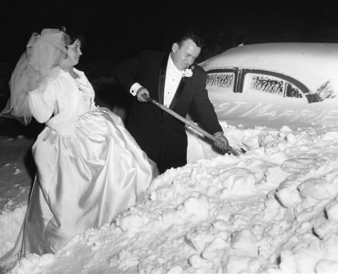 Snowstorm On February 5, 1961; Bride And Groom Shoveling Snow; 17 Inches Of Snow In The Area, Referred To As The Kennedy Inaugural Snowstorm, 1961.