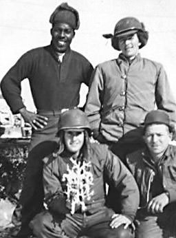 Jordan Czerniawski Of Rossville Is Shown With Three Fellow Army Soldiers Holding A Miniature Christmas Tree Mailed By Czerniawski'S Wife, Winter Of 1952.