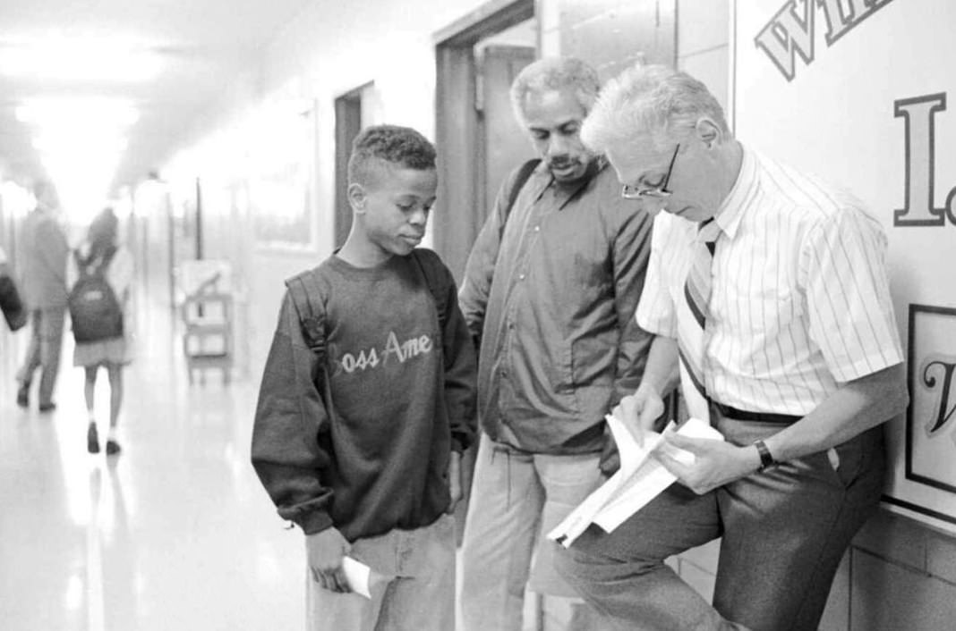 Sal Campanelli Helps Khidar Roberson Find His New Homeroom At Morris Intermediate School In Brighton Heights, 1994.