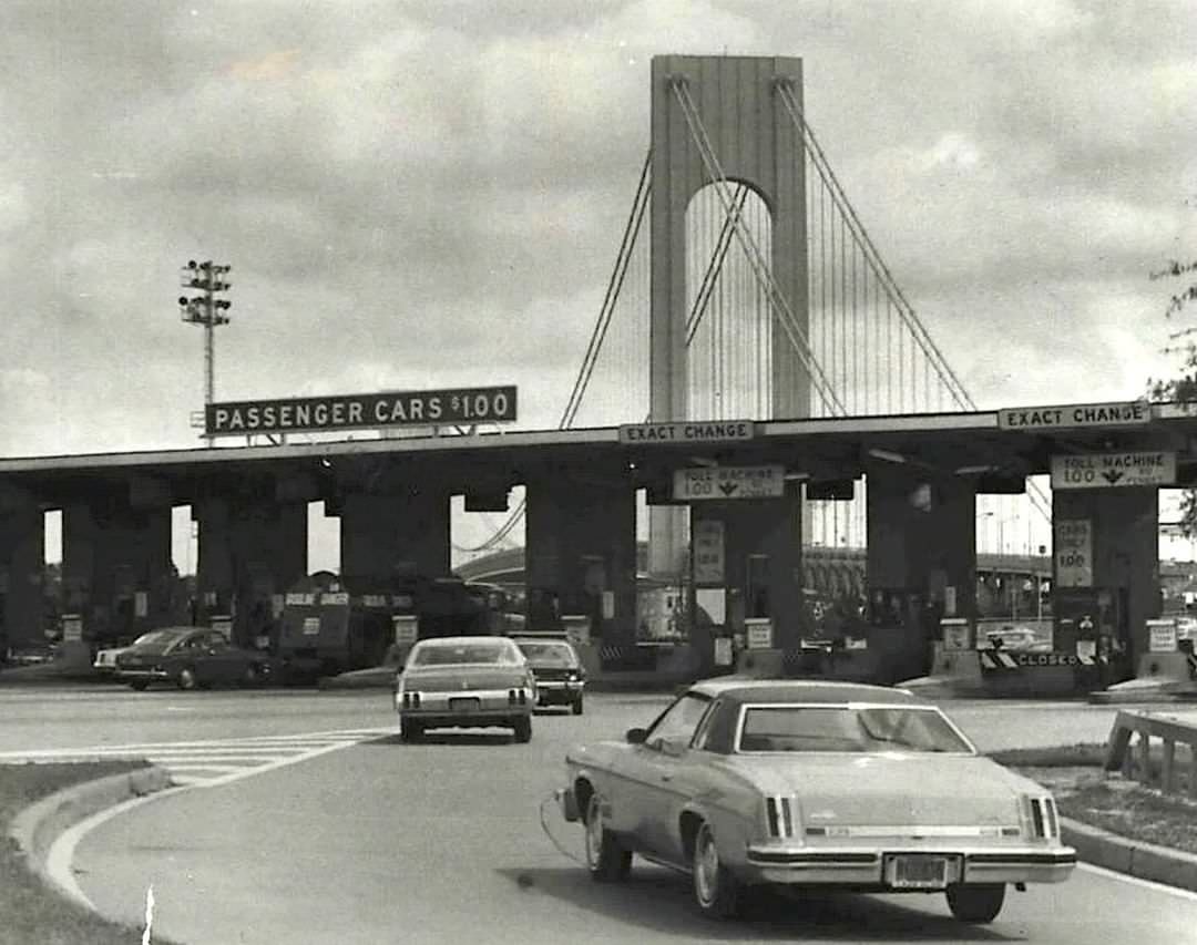 Motorists At Verrazzano-Narrows Bridge Toll Plaza With New Sign For Toll Increase, 1975.