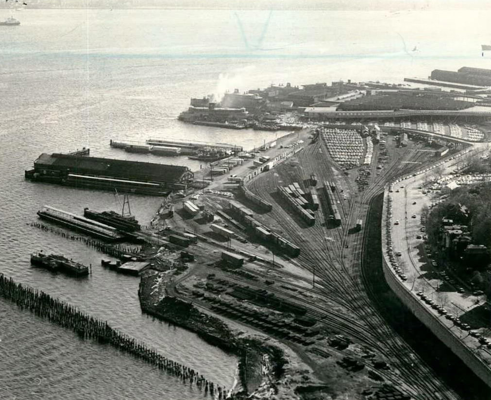 Staten Island Rapid Transit Train Yard With St. George Ferry Terminal In The Background, 1969.