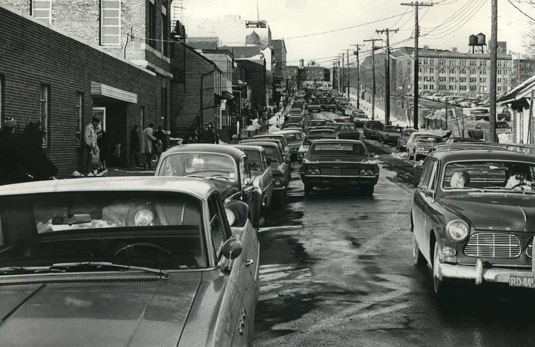 A Last-Minute Rush For Plates Causes Traffic Tie-Up At The Motor Vehicle Office On St. Marks Place, St. George, 1969.