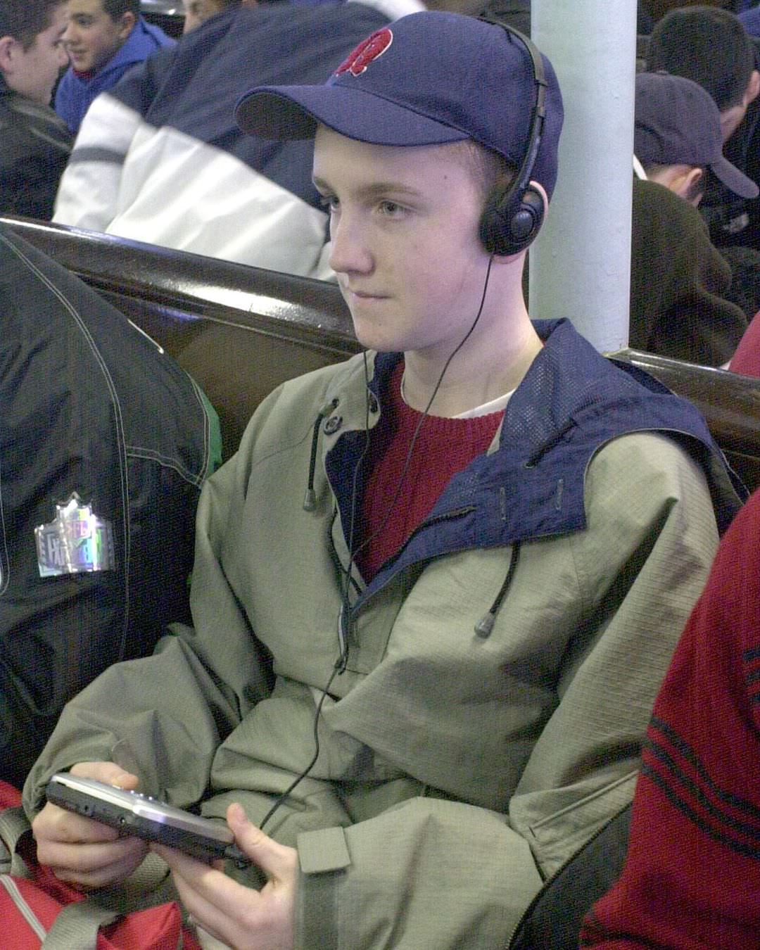 A Teen Listens To Music On A Portable Cd Player While Riding The Staten Island Ferry, 2001.