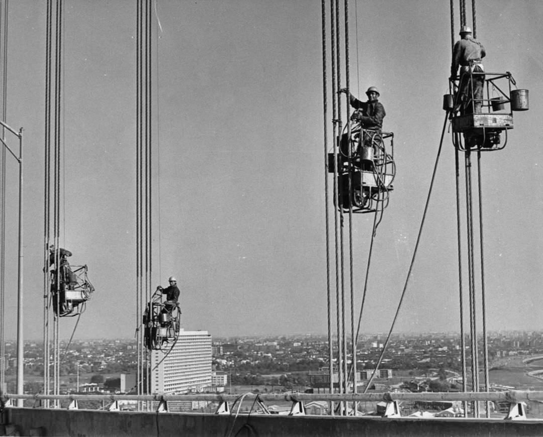 Verrazzano Narrows Bridge Construction, Painters Put Finishing Touches On Cables Above The Waters Of The Narrows, 1964.