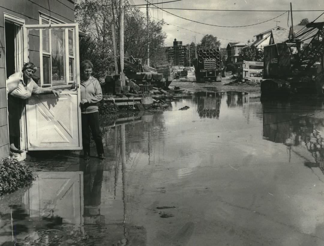 Mary Scholnicoff Looks Out Her Door On A Flooded Ontario Avenue, Sunnyside, May 1983.
