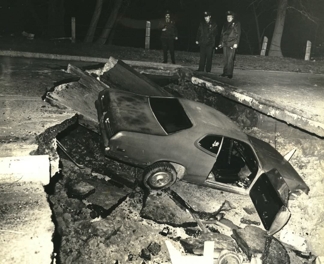 Police Officers Survey A Car That Shot Through Barricades At The Page Avenue Bridge, Tottenville, 1982.