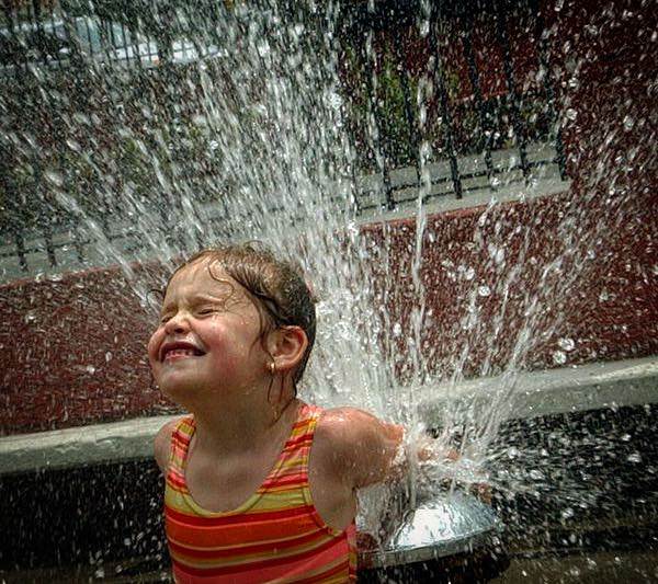 Alexandra Rzonca, 7, Enjoys The Sprinkler At Mcdonald Playground In West Brighton During Heat Wave, 2003.