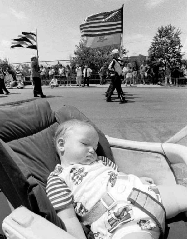 One-Year-Old Timothy Victoria Sleeps Through His First Travis Fourth Of July Parade, 1997.