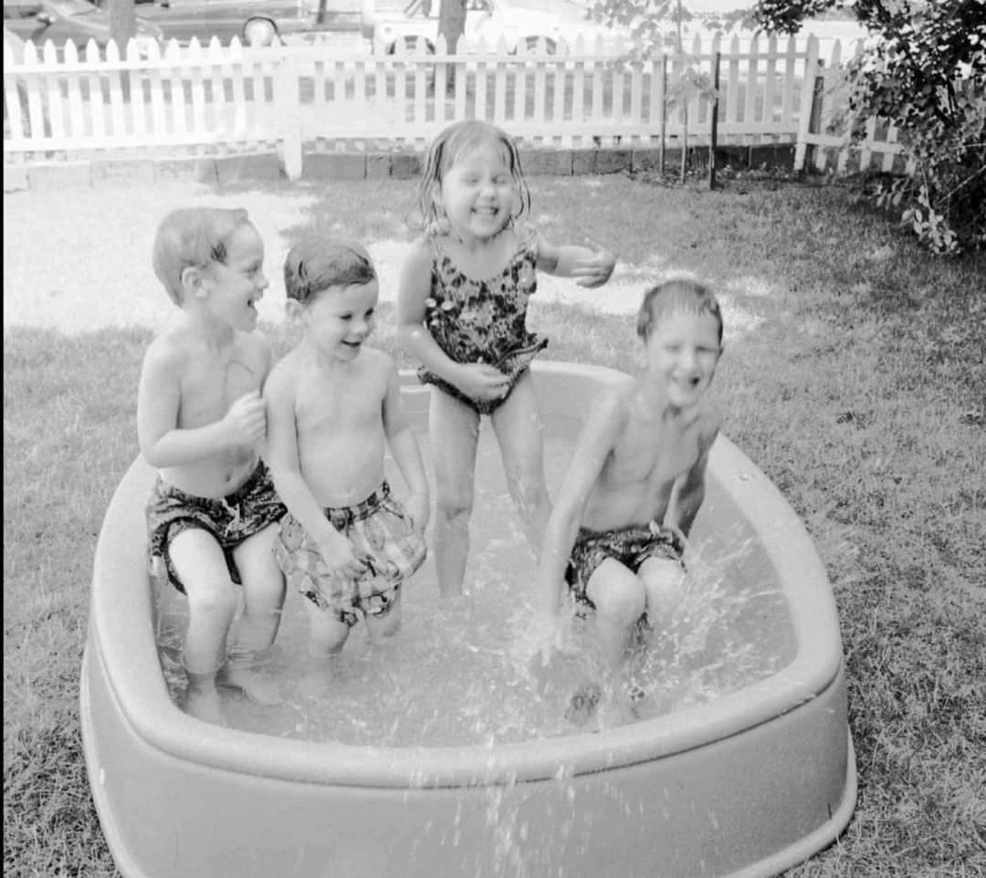 Christofer And Daniel Paolillo Play With Neighbors Caitlin And Jimmy Kelly In A Pool In Tottenville, 1997.