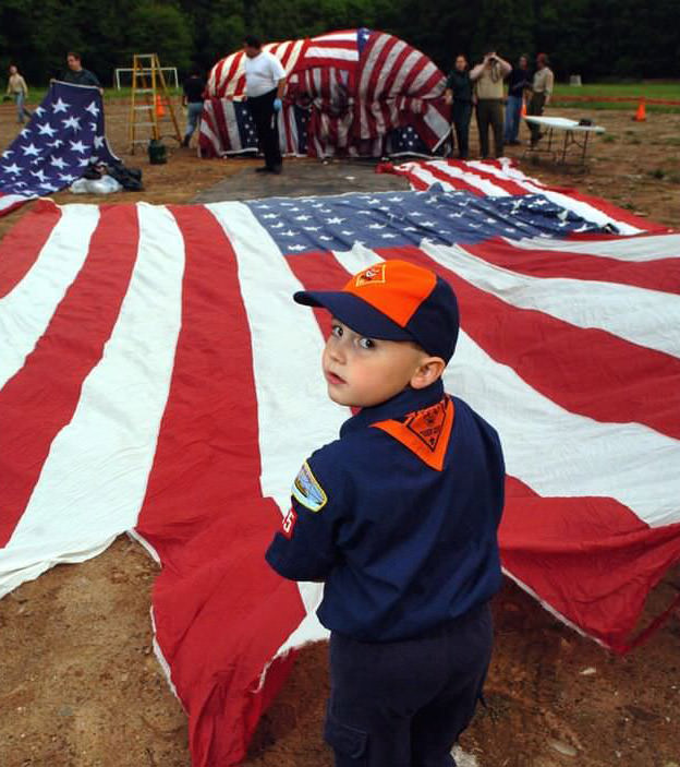 Cub Scout Robert Lynch Helps To Unfurl A Large Flag At The 50Th Annual Old Flag Retirement Ceremony, 2006.