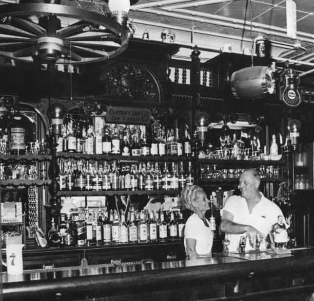 Owners Mr. And Mrs. Cyrenius Simonson Behind The Bar At Century Inn, 1977.