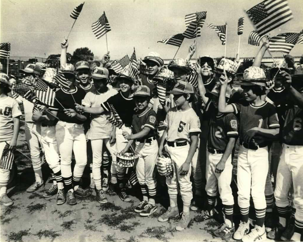 Little League Players Wave Flags During Elm Park 4Th Of July Parade, 1979.