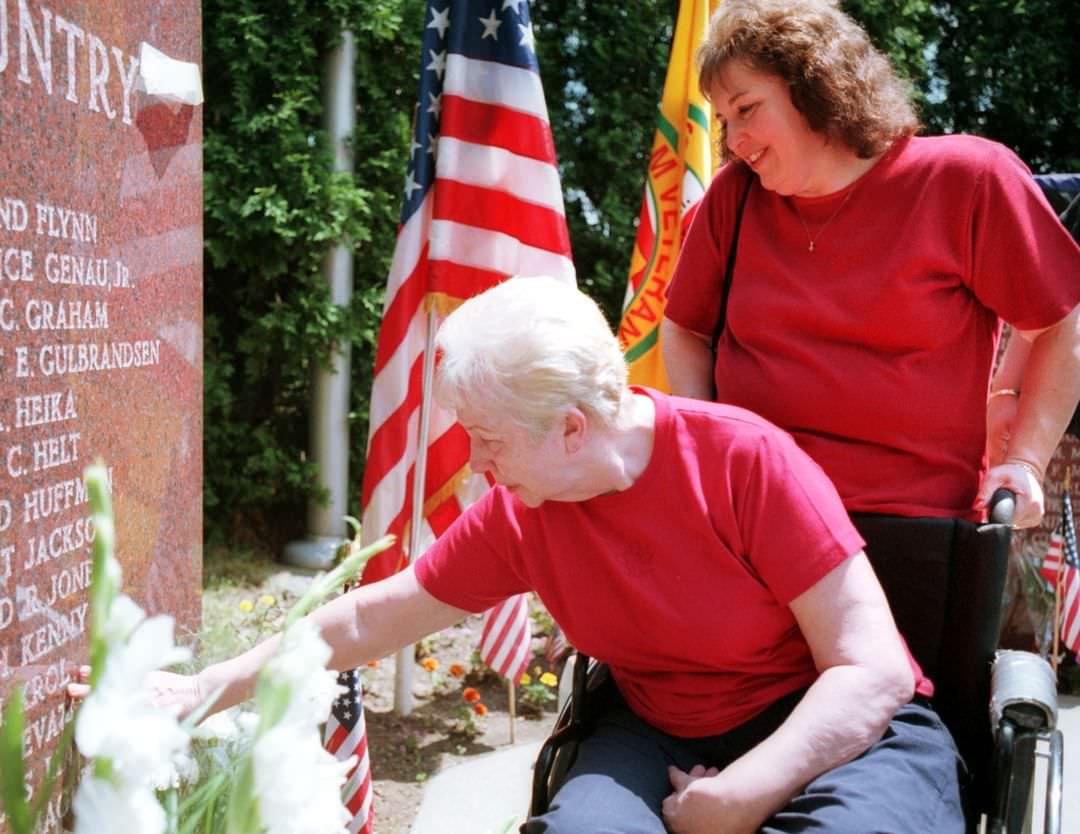 Memorial Day - Honoring Those Who Served: Ann Levato Touches The Name Of Her Late Son, Killed In Vietnam, During The Honor Guard Roll Call, 2001.