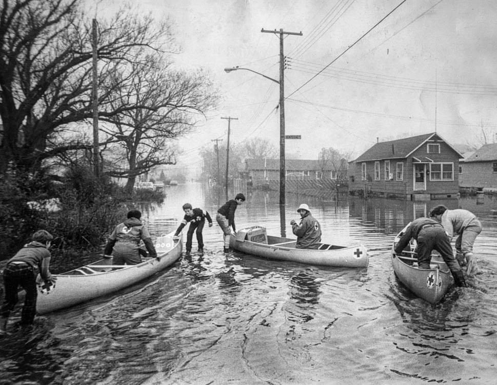 Flooded Staten Island Circa 1975: Red Cross Officials Prepared To Glide Down Freeborn St. To Get To Trapped Residents, 1975.