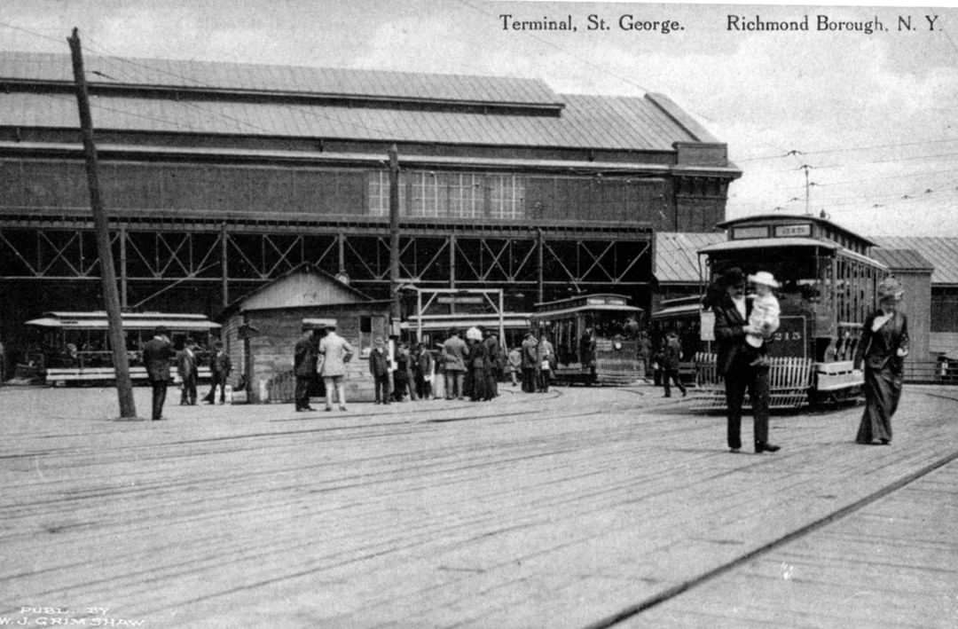 Commute In St. George At The Turn Of The 20Th Century; Staten Island Ferry Passengers Greeted By Waiting Trolleys, 1900S.
