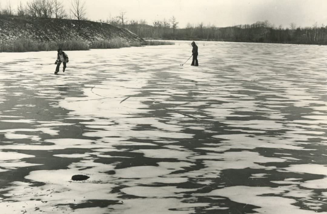 Two Hockey Players On A Frozen Pond Near West Shore Expressway In Charleston, 1980.