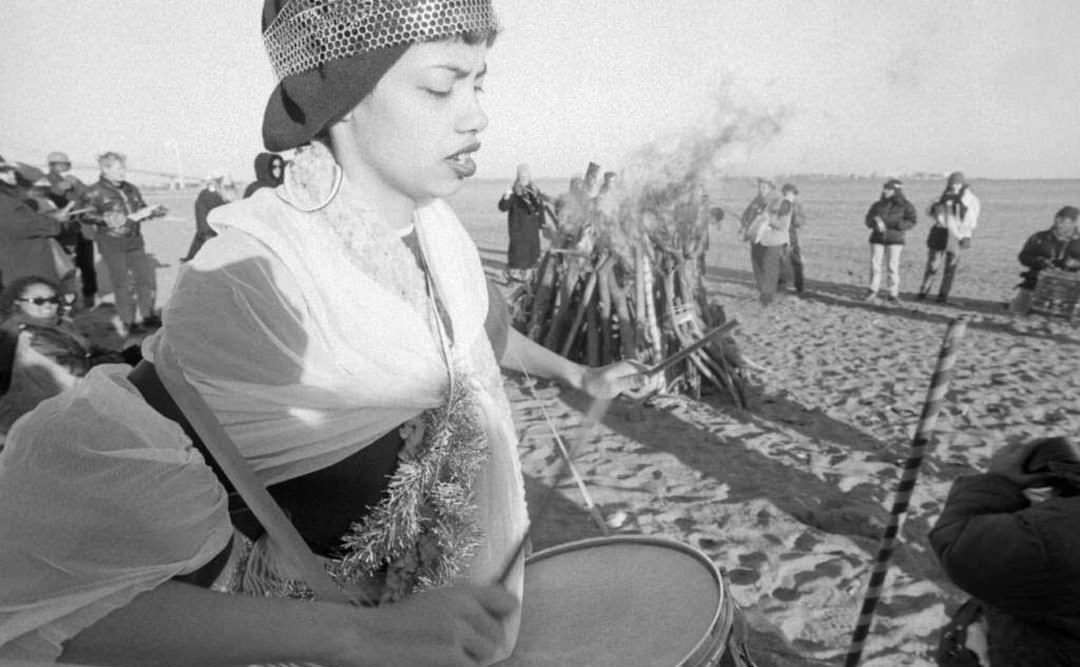 Victoria Santiago Plays A Drum At South Beach To Celebrate The Winter Solstice, 1997.