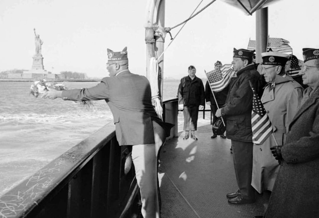 David Jenkins Of The Cichon Post Commemorates Pearl Harbor Day Of Remembrance By Tossing A Wreath Aboard The Staten Island Ferry, 1995.