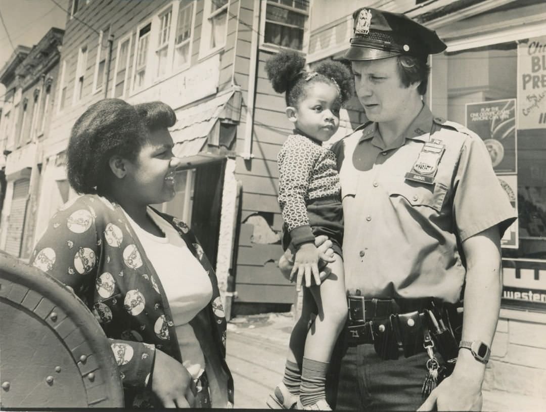Police Officer Jim Sackel Connecting With Children In Stapleton, 1977.