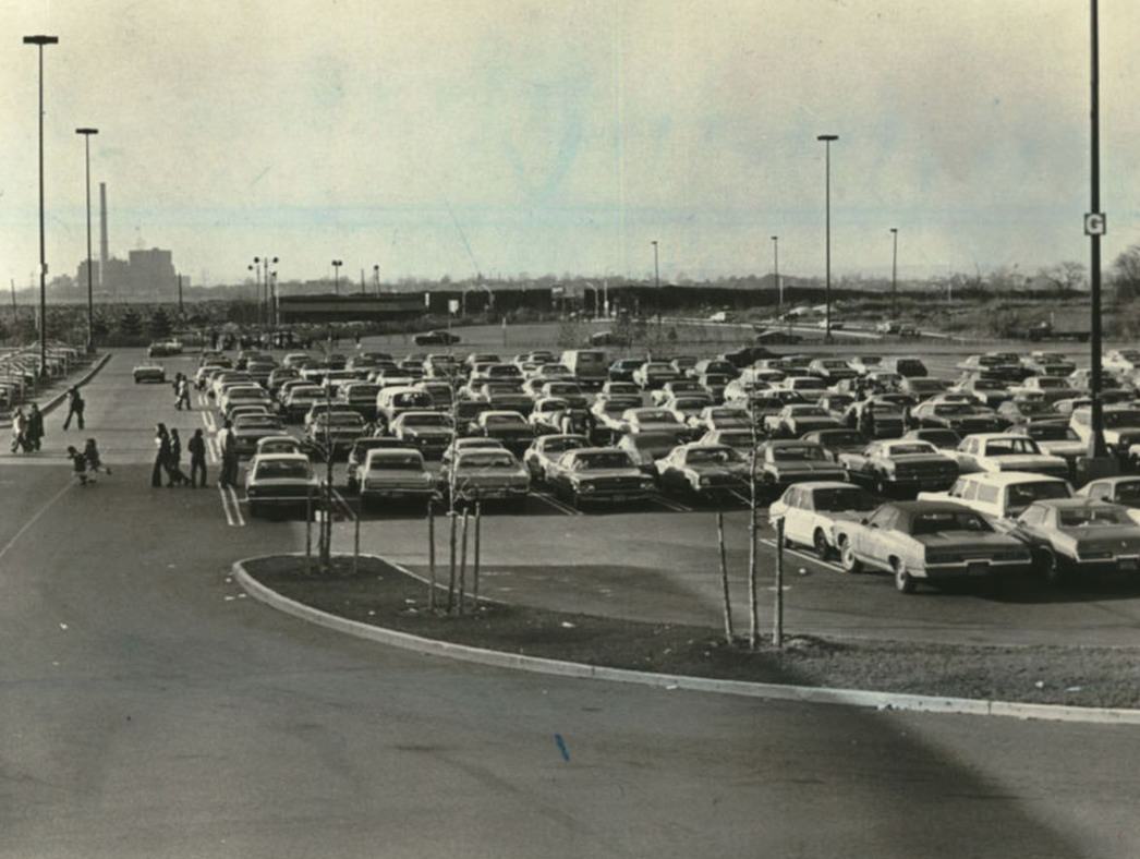 Cars Fill The Parking Lot Behind Macy'S, Fresh Kills Landfill In The Background, 1974.
