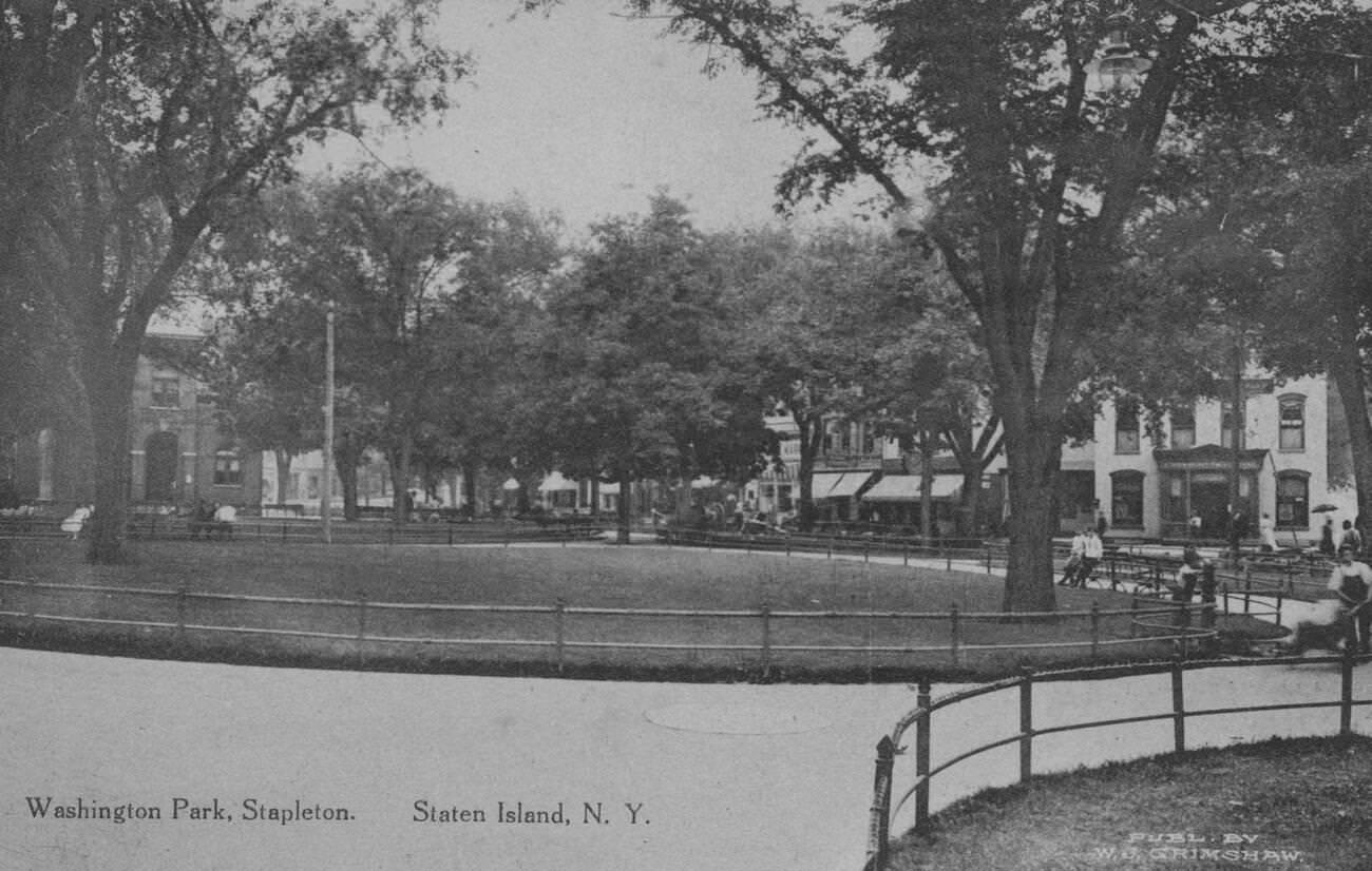 Washington Park In Stapleton, Showing People On Benches And Walkways, Framed By Buildings, Staten Island, 1900.