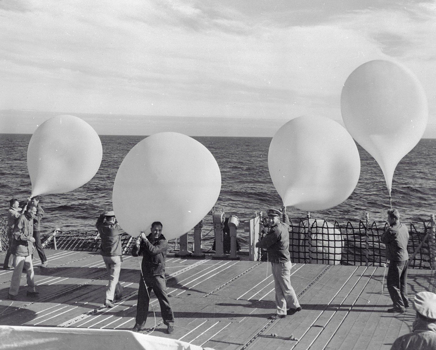 Naval Personnel Launch Balloons For Cosmic Radiation Tests Aboard The Icebreaker U.s.s. Staten Island.
