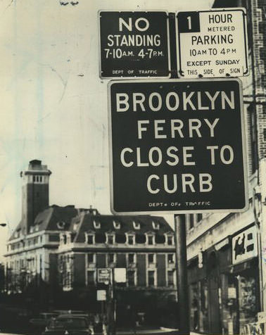 Motorists Directed To Keep Near The Curb On Bay Street In St. George, Lines Of Cars Waiting For The Ferry, 1979.