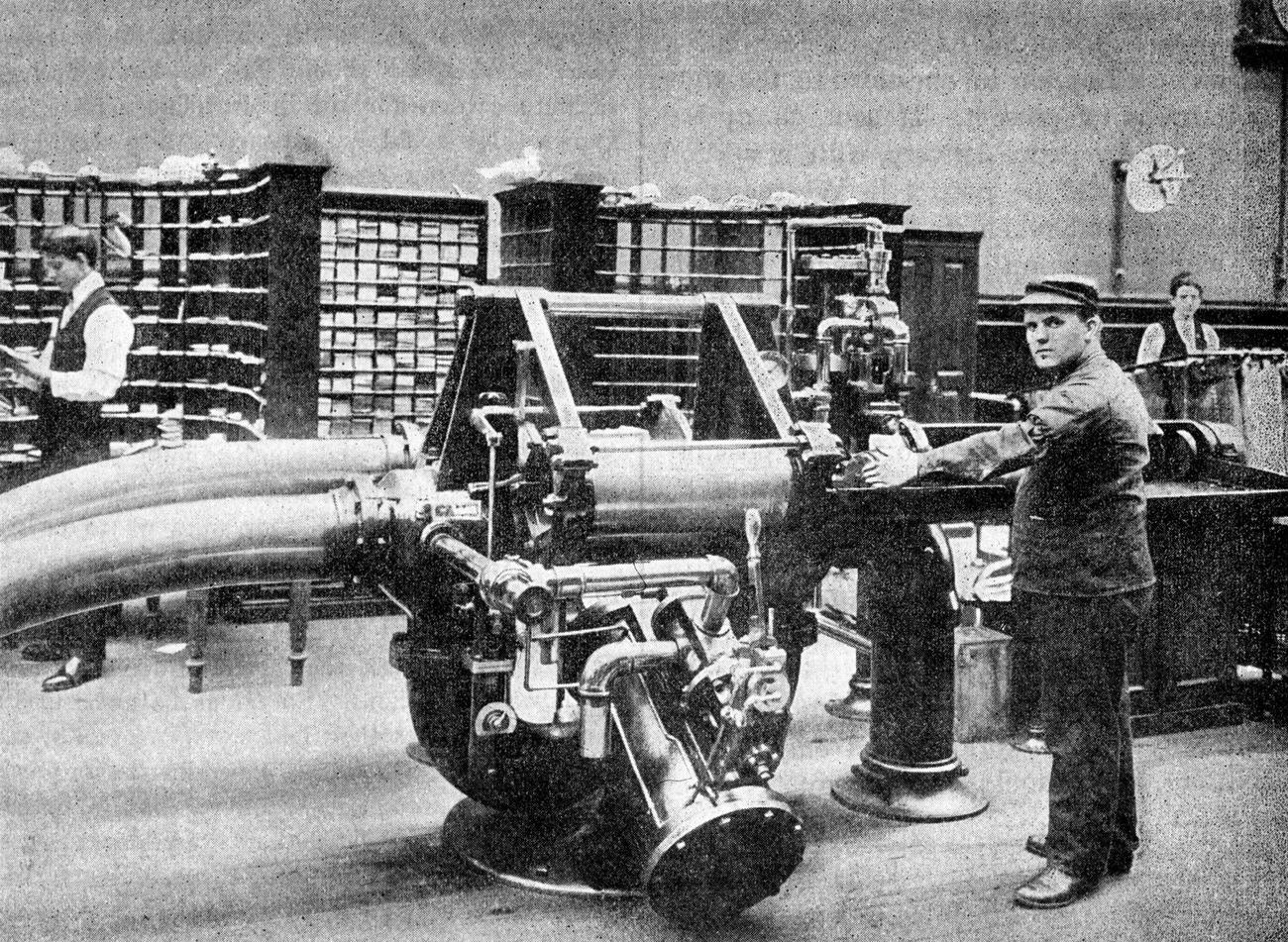 Operator Feeding Letters Into Pneumatic Mail Tube At Brooklyn Post Office, Brooklyn, 1899.