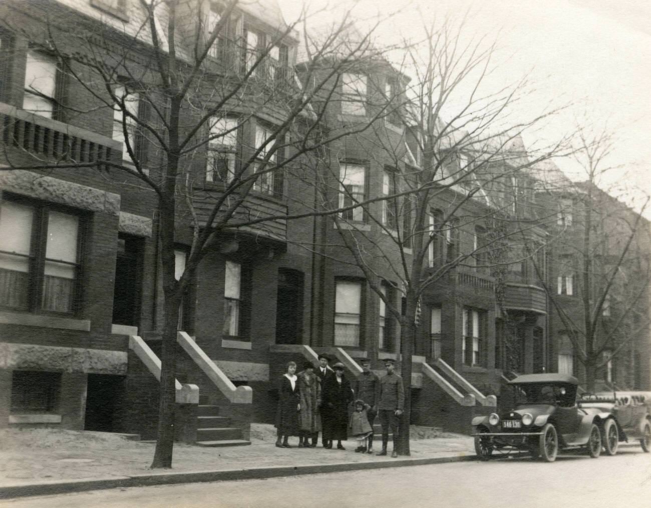 Family With 1918 Buick Parked In Front Of Townhouses, Possibly Brooklyn, 1918