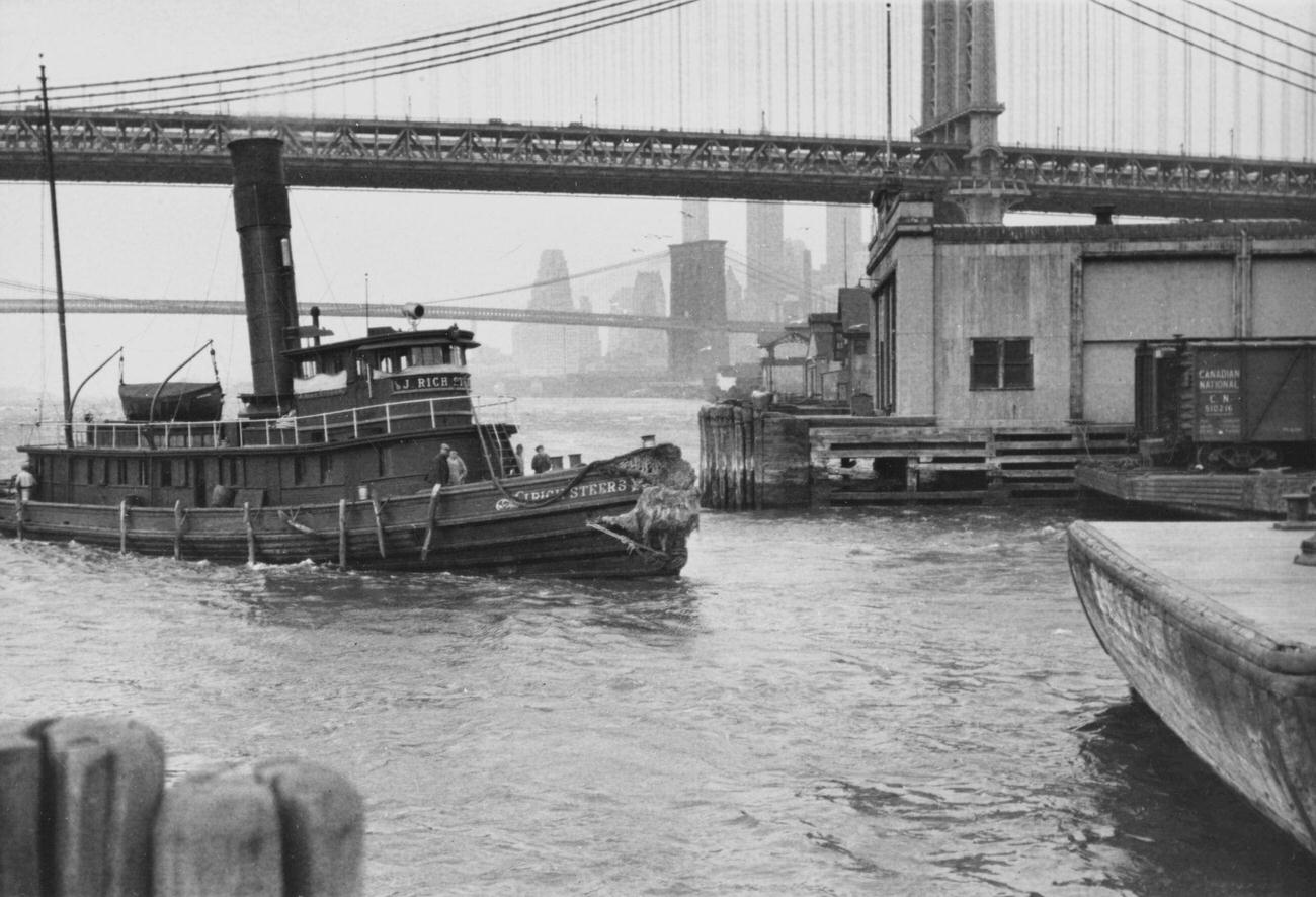 Tugboat Approaching Brooklyn Pier Under Brooklyn Bridge, Circa 1935