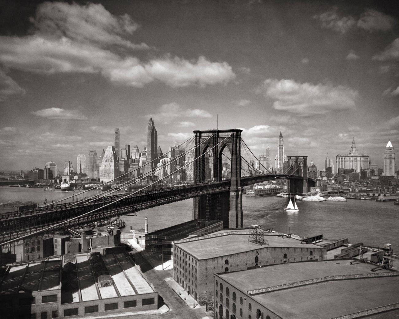 Brooklyn Bridge And Lower Manhattan Skyline Across The East River, Circa 1930S.