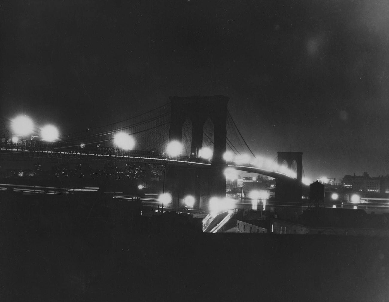 Brooklyn Bridge At Night With Manhattan And Brooklyn Skylines, 1930S