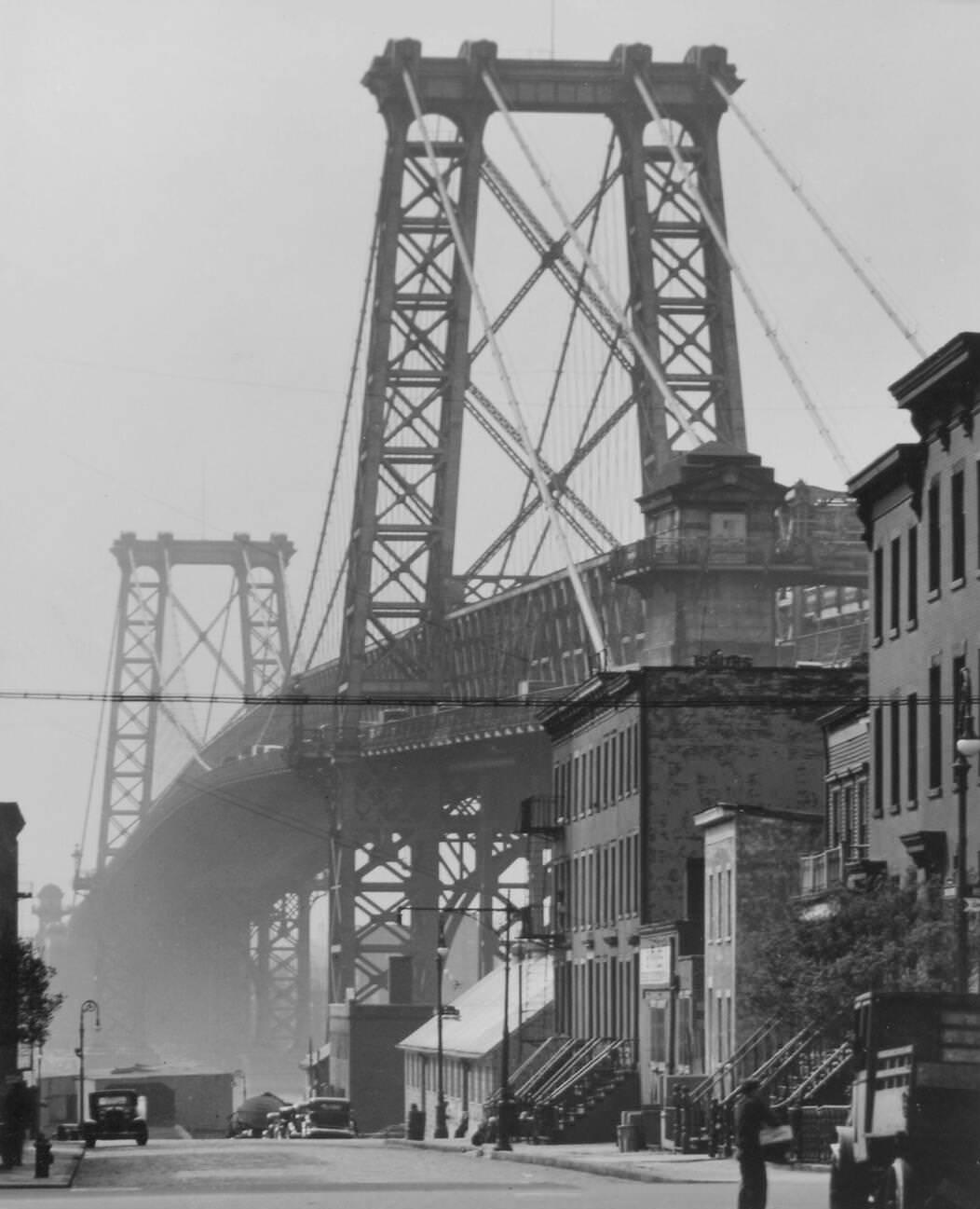 Williamsburg Bridge Rising Above 8Th Street With Homes And Businesses, Brooklyn