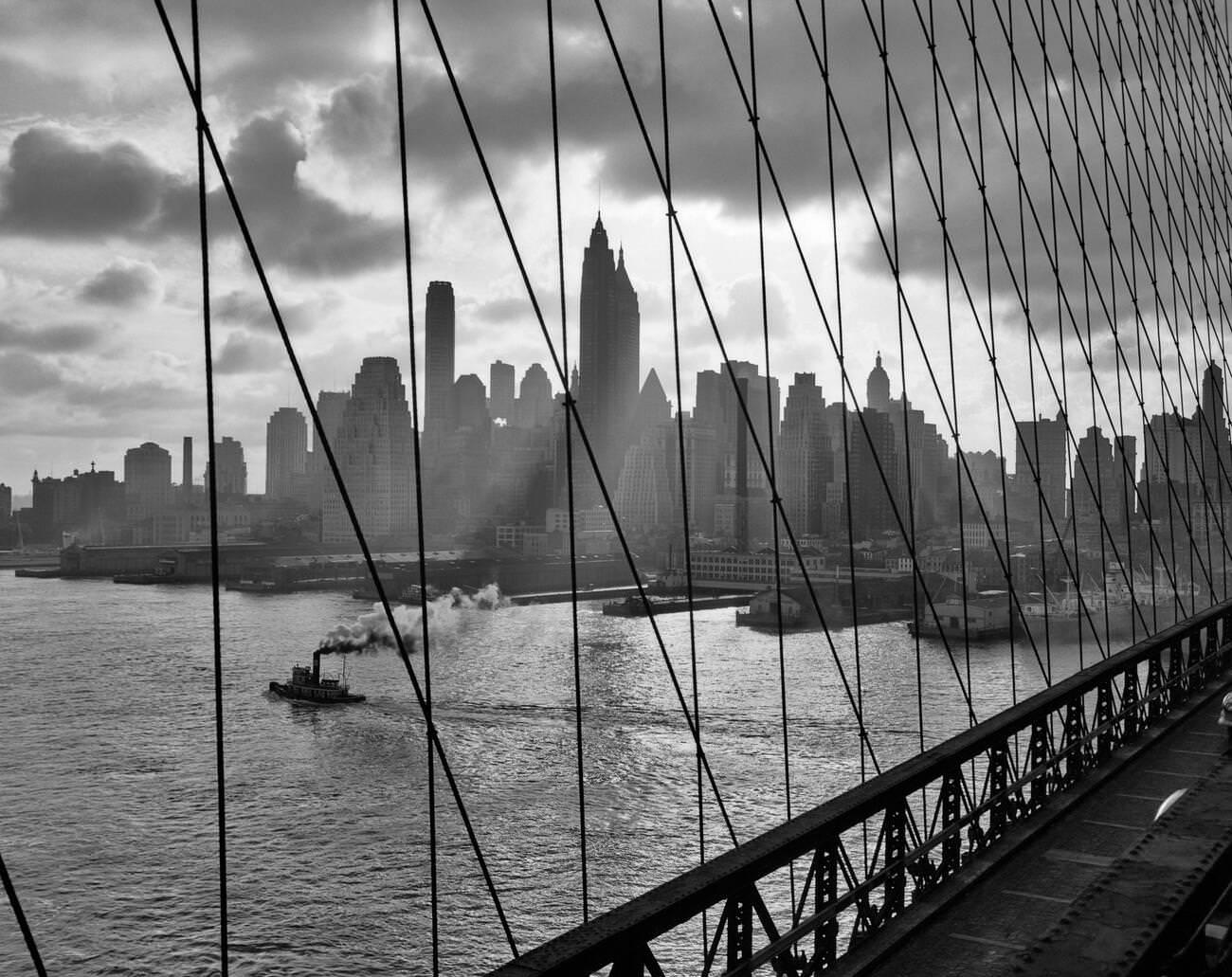 Manhattan Skyline Seen Through Cables Of Brooklyn Bridge, 1940S